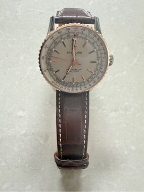 Breitling Navitimer 41 with Rose Gold Dial and Buckle with Alligator Strap.